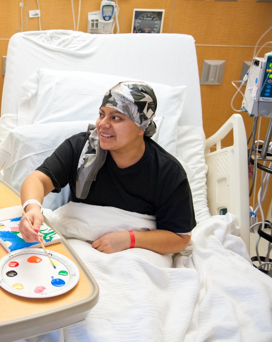 A cherished photograph of her smiling while painting